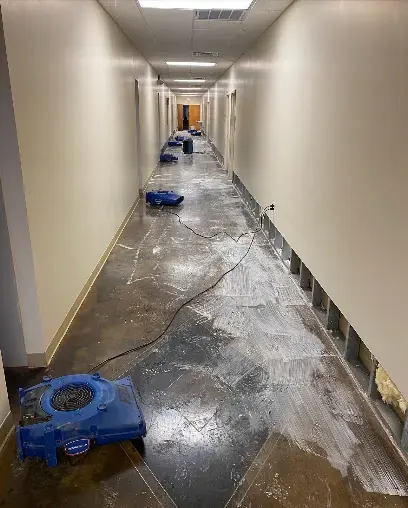 Air mover drying a wet commercial hallway in Duluth, GA